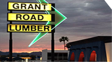 Grant Road Lumber sign at sunset.